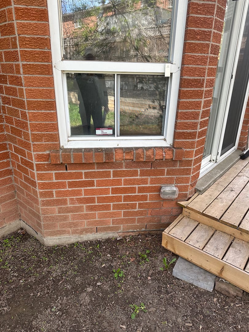 brick failing on a window sill