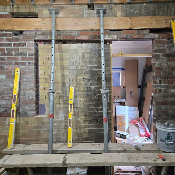 Alterations Being Done On A Brick Wall